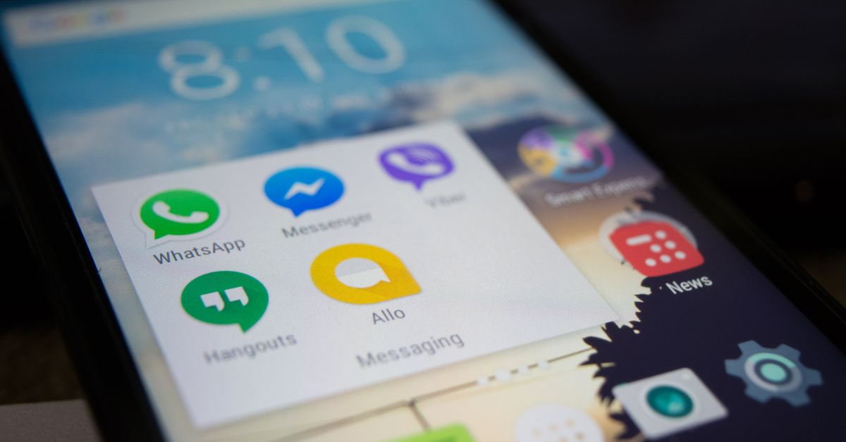 Smartphone screen showing various messaging apps like WhatsApp and Messenger.